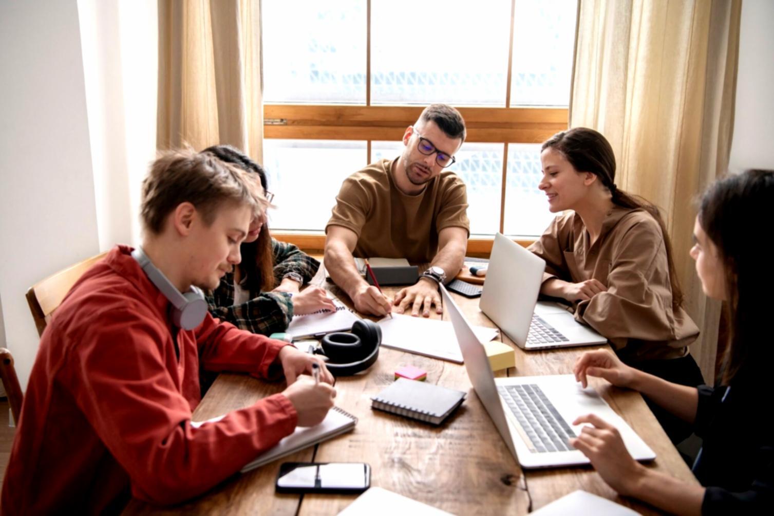 Team collaboration discussing financial concepts in modern workspace